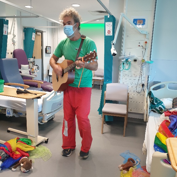 One of our entertainers Dave singing one of his own songs for the children on Rainbow